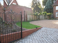 Retaining wall and electric gate